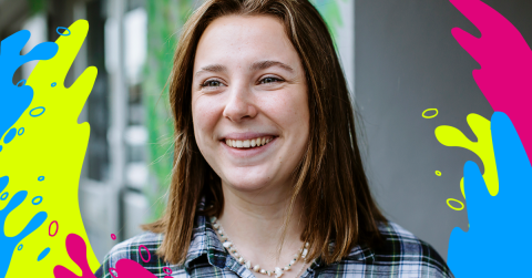 Female student smiling, she has brown hair 