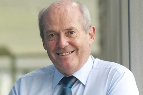 Headshot of Sir William Wakeham smiling to camera