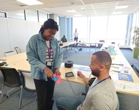 Student pharmacist taking a man's blood pressure