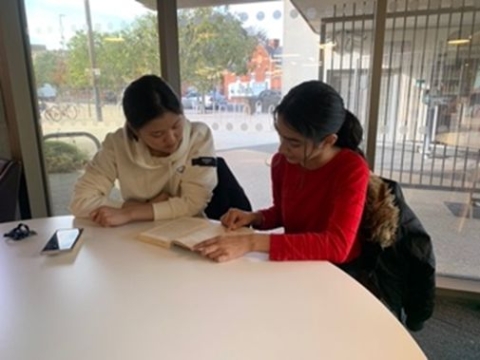 Eunsoo Choi reading with a child