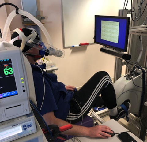 Man cycling in a PET scanner as part of a new study