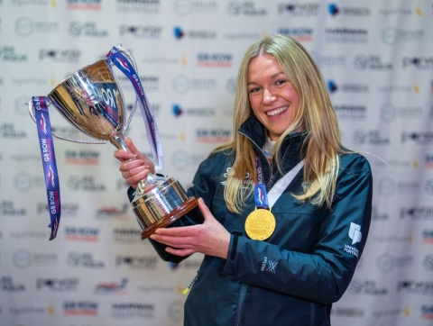 Emma Haxell holding the GB Row Challenge cup