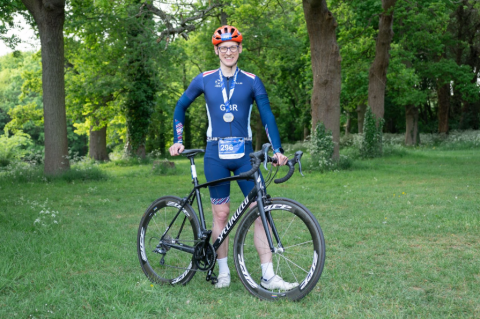 Dr Guy Collender holding his bike
