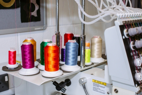 Multicoloured spools on an overlocker