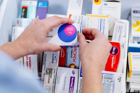 Close up of nursing student handling pharmaceuticals