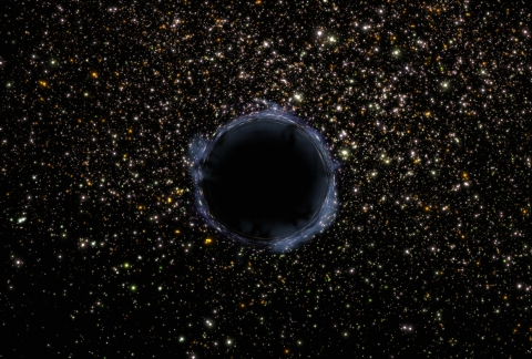 Image of a black hole in space, surrounded by stars