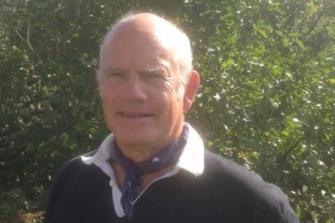 Rob Hutchinson smiling to camera with garden backdrop