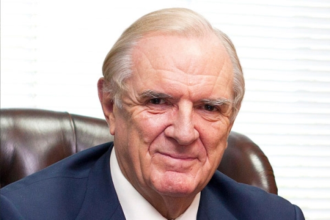 Sir Roger Fry smiling to camera in headshot