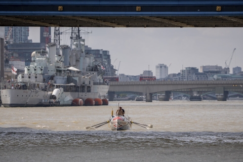 Rowing boat underneath Tower Bridge, London 