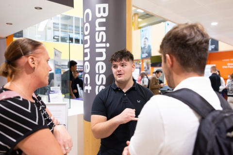 Three people talking