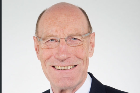 Sir John Armitt smiling to camera
