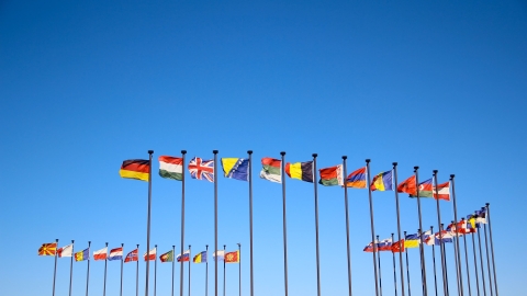Flags of the world against blue sky