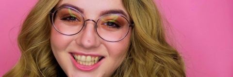 Happy Daniella in a vibrant pink background