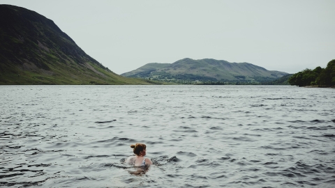 Woman swimming in a lake