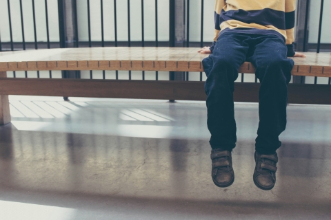 Picture of child sitting on a bench