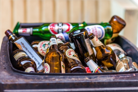 A bin filled with glass bottles