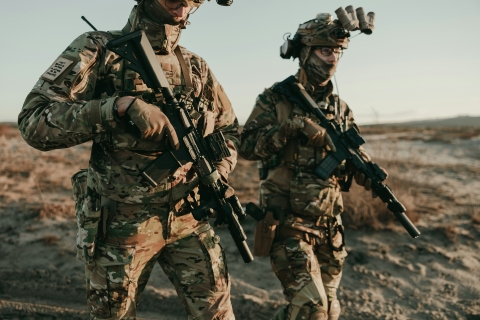 two individuals in military kit