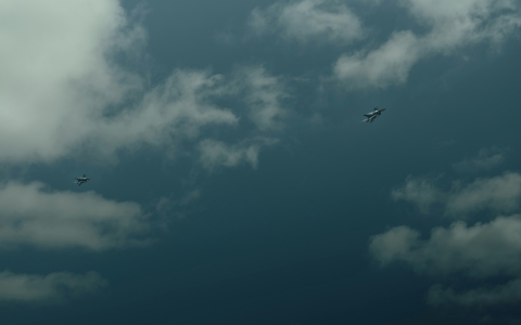 Military aircraft in cloudy sky