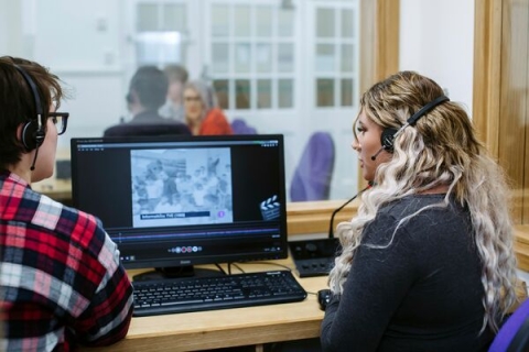 two-people-looking-at-a-screen