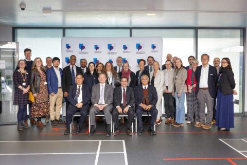 Portsmouth and Malaysian university teams in group photo during signing event