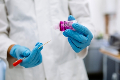 Crime student in lab handling evidence