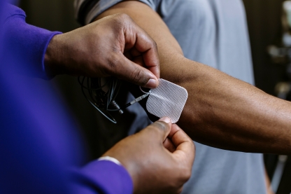  Researcher applying patch to subject's arm