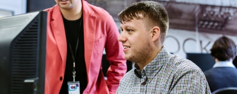 Student using financial software in university's Bloomberg Suite