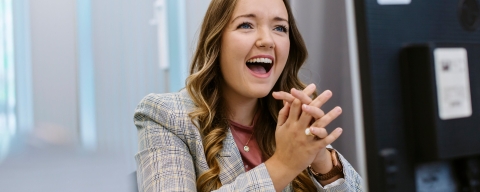 Student smiling using computer