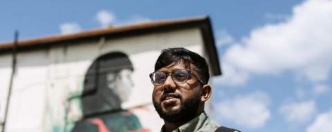 UoP student by London building