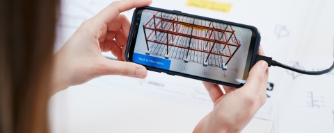 a phone showing a rendered construction design