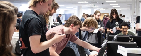 A game development team playing on PC