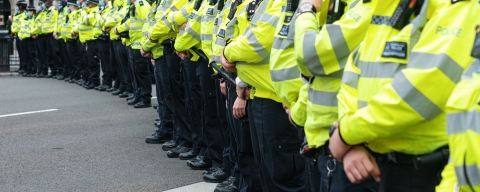 Police officers in a line up with face masks on