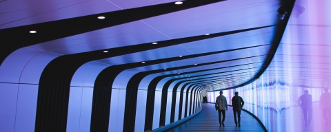 Image of two peple walking down a pathway