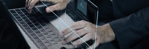 Hands over a laptop keyboard