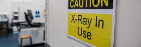 warning sign on the side of an x-ray machine