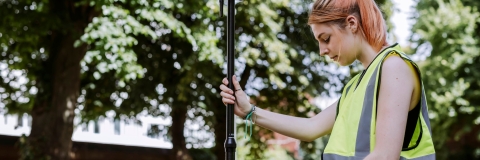 Student uses measurement device outside of Technology Facilities