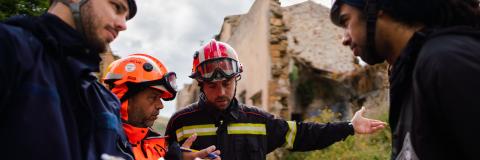 Structural engineers in disaster relief training in earthquake ruins