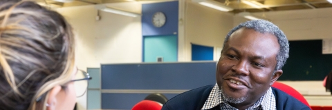 Two people sitting and talking