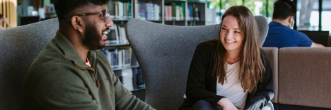 Two students at a seminar desk