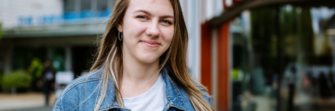 Smiling student outside of library