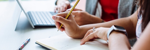 Female lawyer holding a pencil, making notes