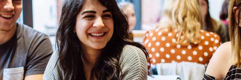 Group of students smiling for international orientation