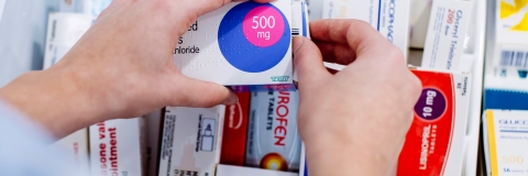 Close up of nursing student handling pharmaceuticals