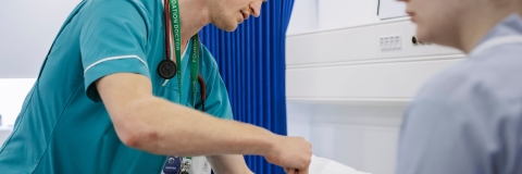 A student in scrubs in our Centre for Simulation in Health and Care