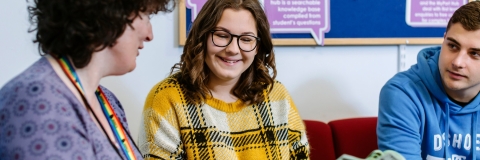 University Student Finance staff advising a student