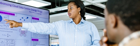 Information analyst looking at data on a monitor