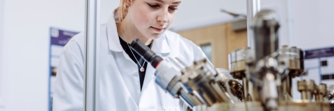 Student conducting observation on device in Technology Facilities