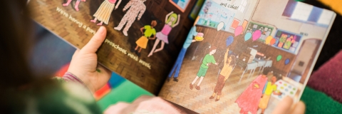 Child holding a picture book