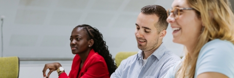 Colleagues discussing ideas in a meeting room