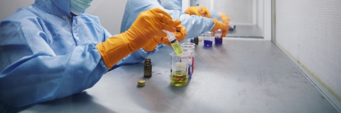 Pharmacology students experimenting with syringe in lab